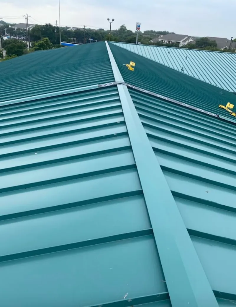 Green commercial metal roof ridge and valley for Metal Roof Repair in South Boston