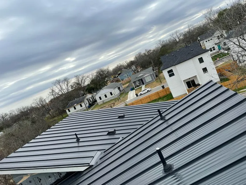 Standing seam metal roof panels with vents for Skylight Repair in South Boston
